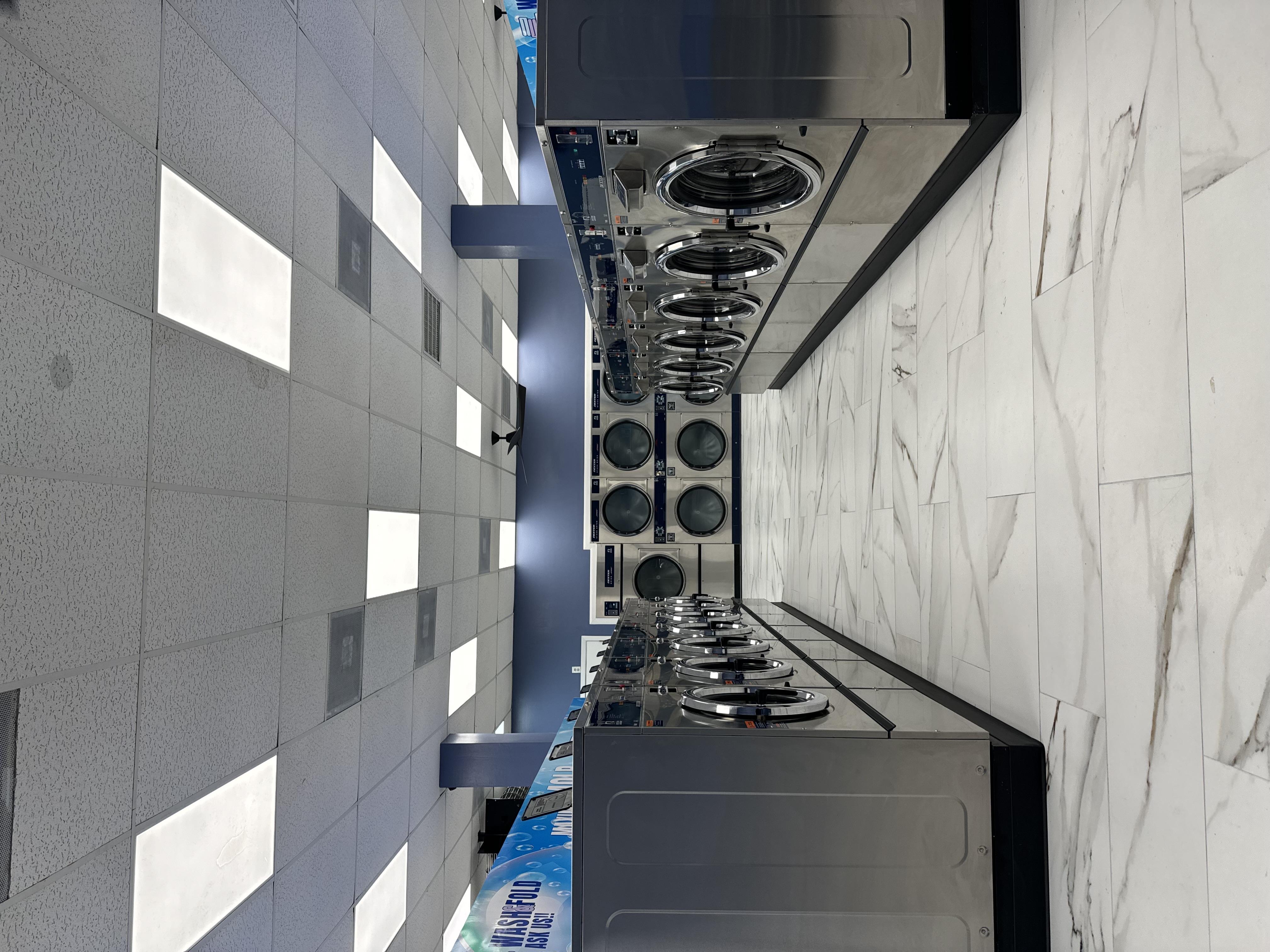 Spacious aisle between two rows of front-load washers